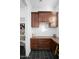 Walk-in pantry with custom cabinets, countertops and shelving providing ample storage space at 18544 W Devonshire Ave, Goodyear, AZ 85395