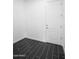 A vacant room offering versatile potential with modern flooring and a clean design at 18544 W Devonshire Ave, Goodyear, AZ 85395