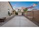 Backyard shed with concrete patio, stone accents, and gravel landscaping, providing a functional outdoor storage solution at 18544 W Devonshire Ave, Goodyear, AZ 85395