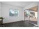 Bright sitting area with natural light, tile flooring, and access to the outdoor space at 18544 W Devonshire Ave, Goodyear, AZ 85395