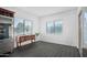 Bright sitting area with natural light, tile flooring, and access to the outdoor space at 18544 W Devonshire Ave, Goodyear, AZ 85395