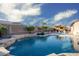 Backyard with lush lawn, trees and landscaping overlooking the swimming pool at 18544 W Devonshire Ave, Goodyear, AZ 85395
