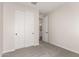 This bedroom has carpet flooring and a closet with folding doors at 18773 E Panchito Dr, Gold Canyon, AZ 85118