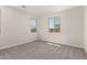 Bright bedroom featuring carpet floors and large windows at 18773 E Panchito Dr, Gold Canyon, AZ 85118