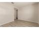 Simple bedroom with wood floors, white walls, and ample lighting at 18773 E Panchito Dr, Gold Canyon, AZ 85118