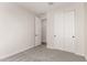 This carpeted bedroom features an en-suite and a large closet at 18773 E Panchito Dr, Gold Canyon, AZ 85118