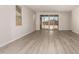 Bright living room featuring wood floors and sliding glass doors to the backyard at 18773 E Panchito Dr, Gold Canyon, AZ 85118