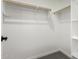 Bright walk-in closet featuring carpeted floor and closet system at 18773 E Panchito Dr, Gold Canyon, AZ 85118