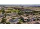 Aerial view of home in a suburban neighborhood with well-maintained landscaping and close to schools and parking at 18811 E Pelican Ct, Queen Creek, AZ 85142