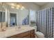 Bathroom showcasing a single sink vanity, a commode and a shower and tub combo at 18811 E Pelican Ct, Queen Creek, AZ 85142