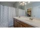 Bathroom featuring a double sink vanity, a shower/tub combo, and neutral finishes at 18811 E Pelican Ct, Queen Creek, AZ 85142