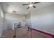 Bonus room with carpet floors, ceiling fan, and gymnastics equipment at 18811 E Pelican Ct, Queen Creek, AZ 85142