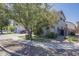 Beautiful two-story home with a two-car garage, complemented by mature, verdant landscaping at 18811 E Pelican Ct, Queen Creek, AZ 85142