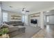 Inviting living room featuring a comfortable gray sectional and neutral decor at 18811 E Pelican Ct, Queen Creek, AZ 85142