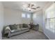 Neutral sitting room featuring plush carpeting, natural light, and a dedicated desk for a functional space at 18811 E Pelican Ct, Queen Creek, AZ 85142