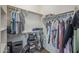 Organized walk-in closet with shelving and hanging rods to maximize storage space at 18811 E Pelican Ct, Queen Creek, AZ 85142