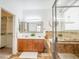 This bathroom boasts a dual sink vanity, soaking tub and walk-in shower, and a walk-in closet at 19403 E Arrowhead Trl, Queen Creek, AZ 85142