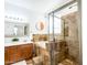 Beautiful bathroom features a soaking tub, walk-in shower and dual sink vanity with granite counters at 19403 E Arrowhead Trl, Queen Creek, AZ 85142