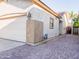 Home exterior featuring a wide driveway made of decorative brick leading to the attached garage at 19403 E Arrowhead Trl, Queen Creek, AZ 85142