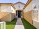 Inviting front entrance with a well-maintained walkway, low-maintenance landscaping, and decorative exterior lighting at 19403 E Arrowhead Trl, Queen Creek, AZ 85142
