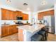 Spacious kitchen island, granite countertops, stainless steel appliances, and wood cabinets at 19403 E Arrowhead Trl, Queen Creek, AZ 85142