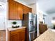 Beautiful kitchen featuring granite countertops and stainless steel refrigerator at 19403 E Arrowhead Trl, Queen Creek, AZ 85142