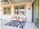 Comfortable covered patio seating area is perfect for entertaining friends and Gathering at 19403 E Arrowhead Trl, Queen Creek, AZ 85142
