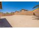 Spacious backyard enclosed by a block fence providing privacy and ample space for outdoor activities at 22196 W Tonto St, Buckeye, AZ 85326
