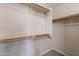 Walk-in closet with shelves and a hanging rod providing ample storage space at 22196 W Tonto St, Buckeye, AZ 85326