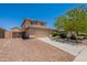 Attractive two-story home featuring neutral stucco exterior and a convenient two-car garage with extended driveway at 22196 W Tonto St, Buckeye, AZ 85326