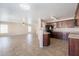Seamless transition between kitchen and living room features tile floors and an open layout perfect for entertaining at 22196 W Tonto St, Buckeye, AZ 85326