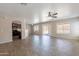 Bright, open-concept living room featuring tile flooring, ample natural light, and a smooth transition to the kitchen at 22196 W Tonto St, Buckeye, AZ 85326