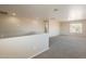 Upstairs landing area features neutral walls, plush carpet, and view to a hallway at 22196 W Tonto St, Buckeye, AZ 85326