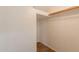 A walk-in closet with tile flooring and a hanging rod at 22196 W Tonto St, Buckeye, AZ 85326