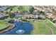 Community aerial view featuring the golf course, clubhouse, pool, and surrounding residential area at 23756 S Vacation Way, Sun Lakes, AZ 85248