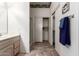 Bright bathroom featuring double sinks and a closet for storage at 23756 S Vacation Way, Sun Lakes, AZ 85248