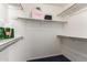 Walk-in closet with ample shelving and carpeted floor at 23756 S Vacation Way, Sun Lakes, AZ 85248