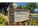 Elegant Oakwood Country Club sign welcoming residents and visitors to this exceptional community at 23756 S Vacation Way, Sun Lakes, AZ 85248