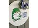 Charming 'Gnome Sweet Gnome' door decor with blue checked bow and a golfer gnome for a warm welcome at 23756 S Vacation Way, Sun Lakes, AZ 85248