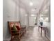 Bright entryway with neutral colors, decorative furniture, and tile flooring, leading into the home's living spaces at 23756 S Vacation Way, Sun Lakes, AZ 85248