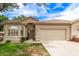 Charming single-story home with tile roof, desert landscaping, and a spacious two-car garage in a beautiful neighborhood at 23756 S Vacation Way, Sun Lakes, AZ 85248