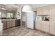 Spacious kitchen featuring tiled floors, stainless steel appliances, and neutral-toned cabinets at 23756 S Vacation Way, Sun Lakes, AZ 85248