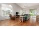 Spacious living room with hardwood floors, vaulted ceilings, ample natural light, and comfortable seating at 23756 S Vacation Way, Sun Lakes, AZ 85248