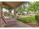 Charming covered patio overlooking landscaped common area at 23756 S Vacation Way, Sun Lakes, AZ 85248