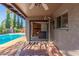 Inviting patio with views of the pool and lush greenery, perfect for outdoor relaxation and entertainment at 2402 E Cinnabar Ave, Phoenix, AZ 85028