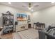 Entertainment room with sleek furniture, TV, ceiling fan, and decor for relaxation at 2402 E Cinnabar Ave, Phoenix, AZ 85028