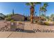 A beautiful residence has well-maintained landscaping, enhancing its curb appeal at 2402 E Cinnabar Ave, Phoenix, AZ 85028