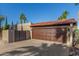 The home features a private garage and gated entrance, enhancing security and curb appeal at 2402 E Cinnabar Ave, Phoenix, AZ 85028