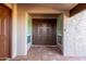Welcoming front entry with a striking door design and tiled flooring, creating an inviting first impression at 2402 E Cinnabar Ave, Phoenix, AZ 85028