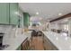 This stylish kitchen features custom cabinets, granite countertops, a farmhouse sink, and stainless appliances at 2402 E Cinnabar Ave, Phoenix, AZ 85028